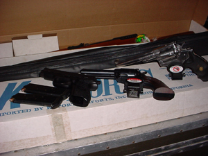After Roger Mills died in a parachute accident, his wife, Kathy Mills, found multiple weapons in his home and storage units.
