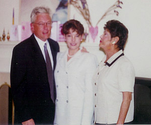 Joyce Jaccodie, right, was permanently scarred after the acid attack. Here she is with her daughter, Stacey Jaccodie, and Stacey's husband, Steve.